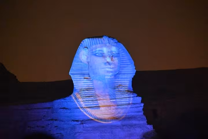 Great Sphinx of Giza illuminated in blue during the Sound and Light Show at the Pyramids, Cairo night tour