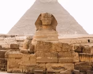 Great Sphinx of Giza with pyramid in background, Egypt
