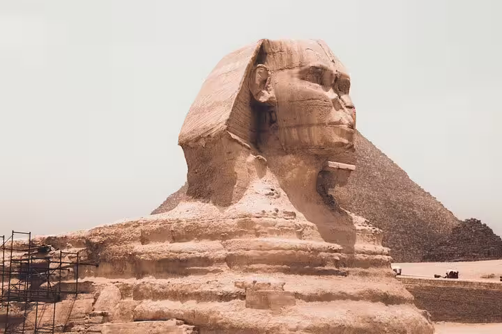 Great Sphinx of Giza with pyramid backdrop, Cairo day tour to Pyramids, Memphis and Saqqara included