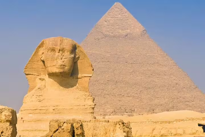Great Sphinx with Pyramid of Khafre behind, highlight of Pyramids of Giza tour with Egyptian Museum and Coptic Cairo