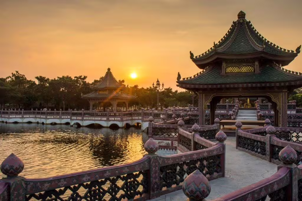 Serene Chinese pavilion and bridge at sunset, perfect for Great Wall and Warriors private tour experience.
