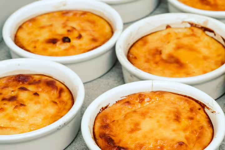 Baked Greek dessert in ramekins from Athens cooking class, served at rooftop dinner with Acropolis view