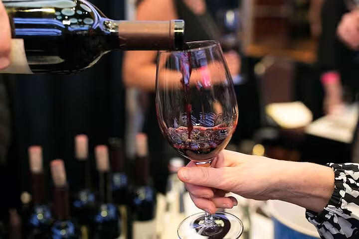 Sommelier pours Greek red wine for a private Athens wine tasting experience with personal licensed guide