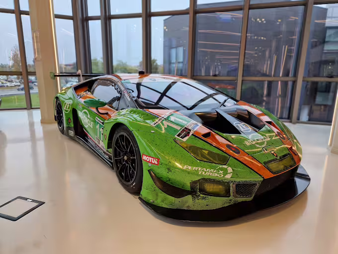Green Lamborghini race car on display at Lamborghini Museum near Bologna, ticket to Modena Ferrari museum