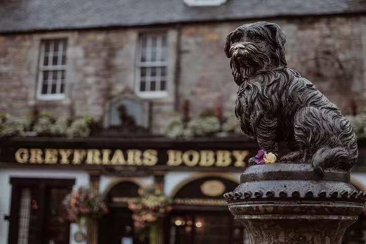 Greyfriars Bobby bronze dog statue outside the Greyfriars Bobby pub in Edinburgh