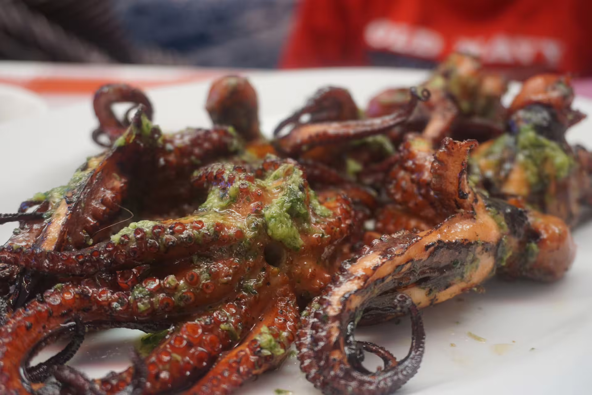Grilled octopus with green herbs, a culinary highlight on the São Vicente Island tour from Praia.