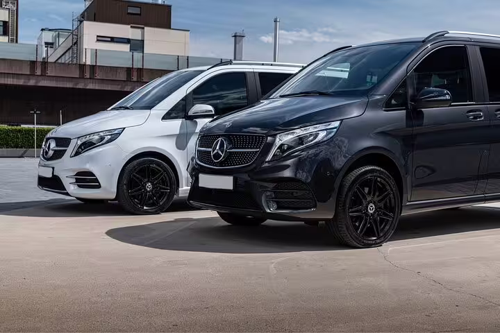 Luxurious Mercedes vans ready for the Grindelwald First adventure tour departure from Zurich.