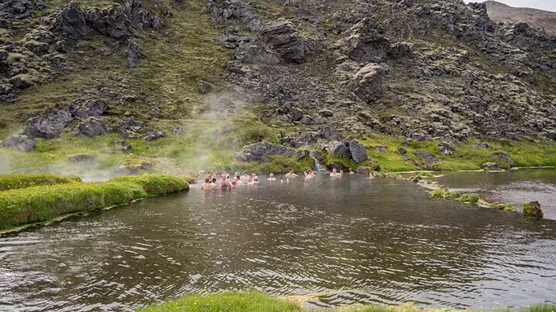 A group of people bathing in a hot spring 
