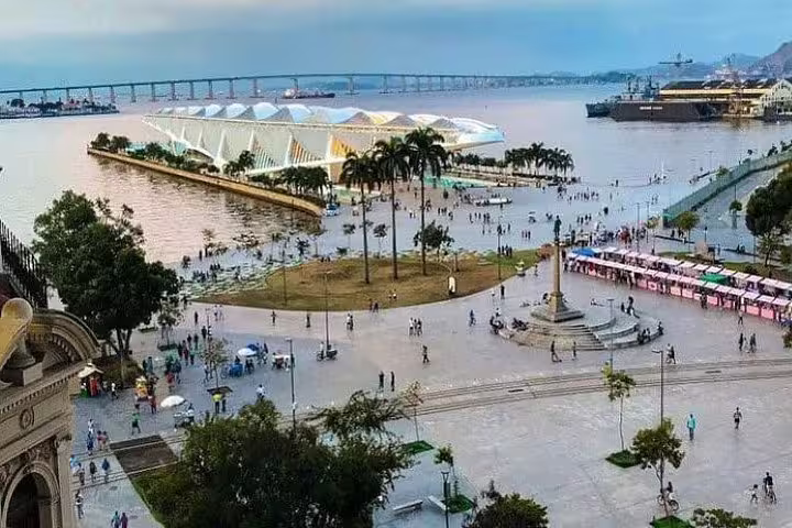 Scenic view of Guanabara Bay with the Museum of Tomorrow and bustling promenade on the Rio boat tour.