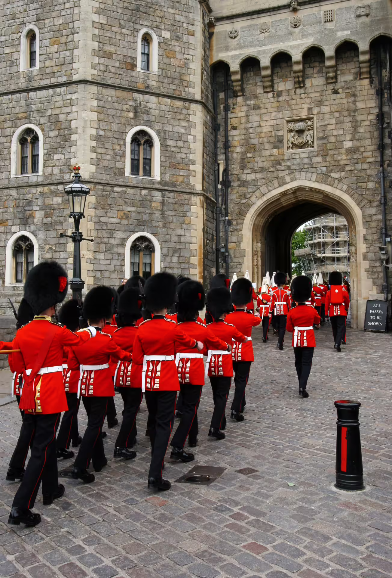 Guards in red uniforms marching at Windsor Castle, featured on London Royal Walk 1-day audio-guided tour