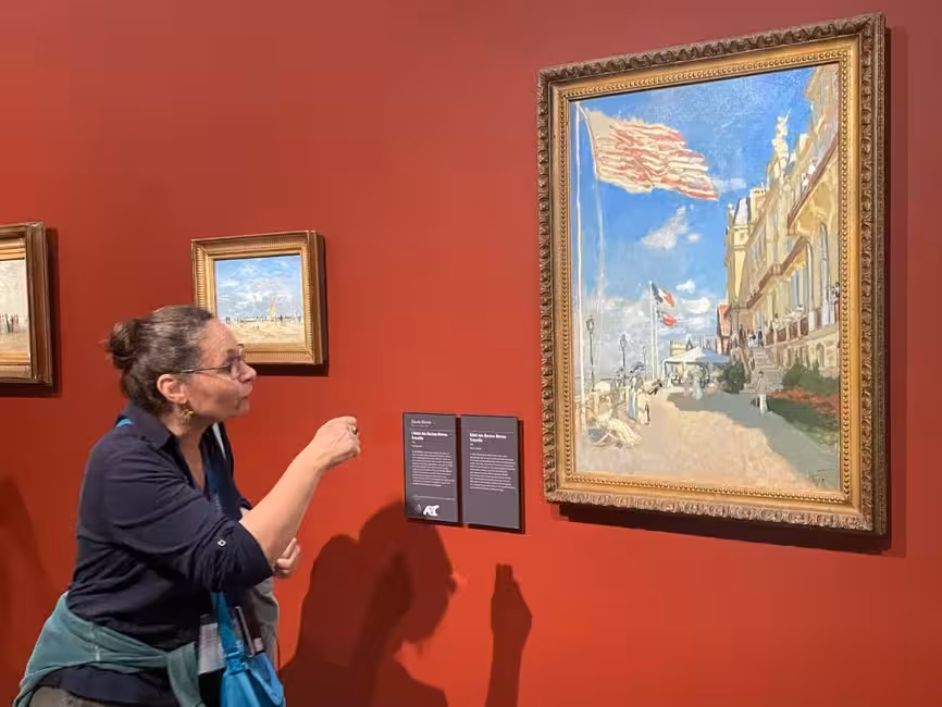Visitor admiring Claude Monet painting at Musée d'Orsay Paris guided tour