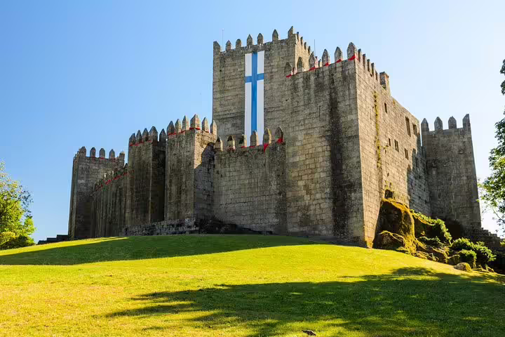 Experience the impressive architecture of Guimarães Castle, a highlight of the private tour from Porto.
