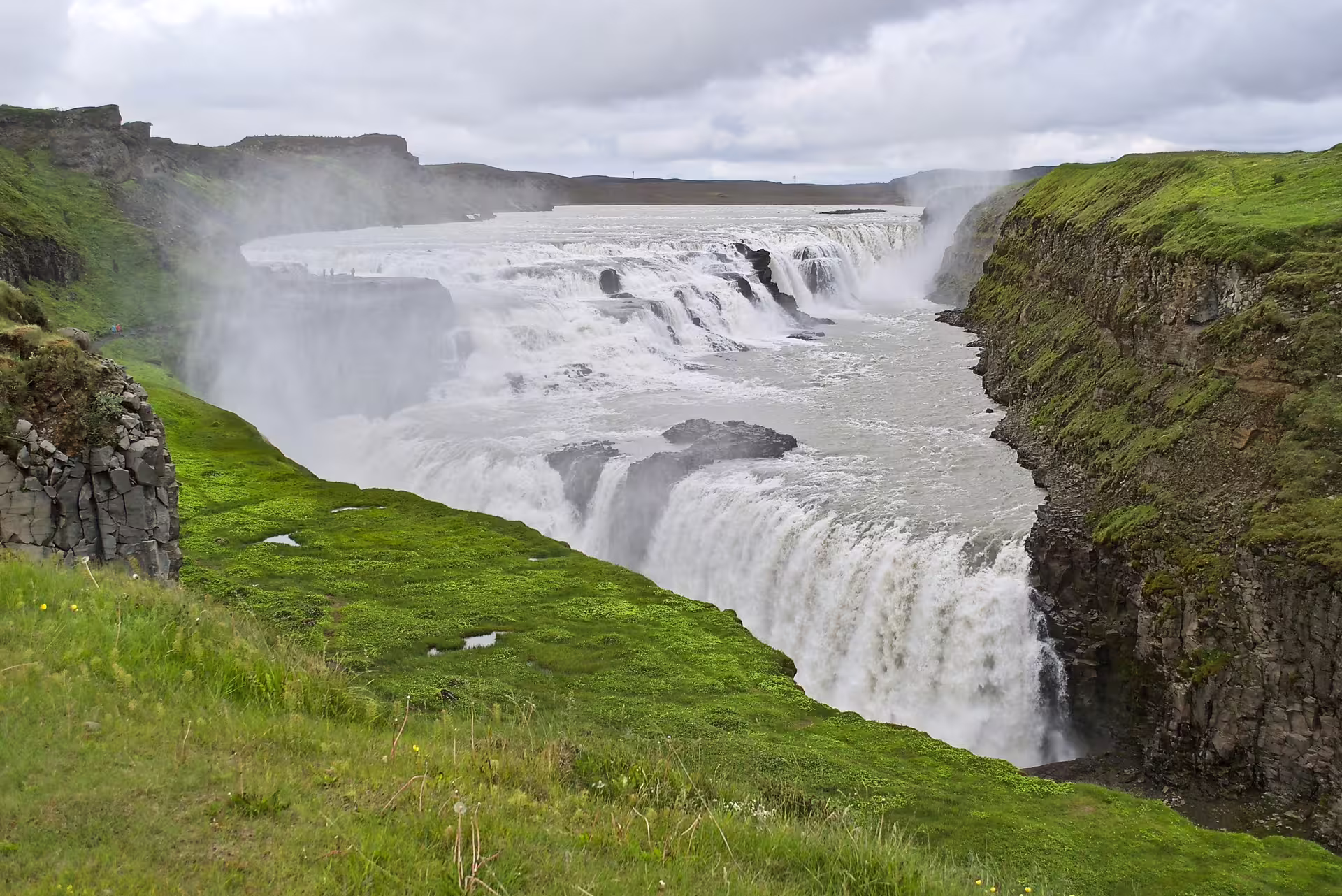 Gullfoss waterfall roaring in a green canyon on a Private Golden Circle tour from Reykjavik, Iceland