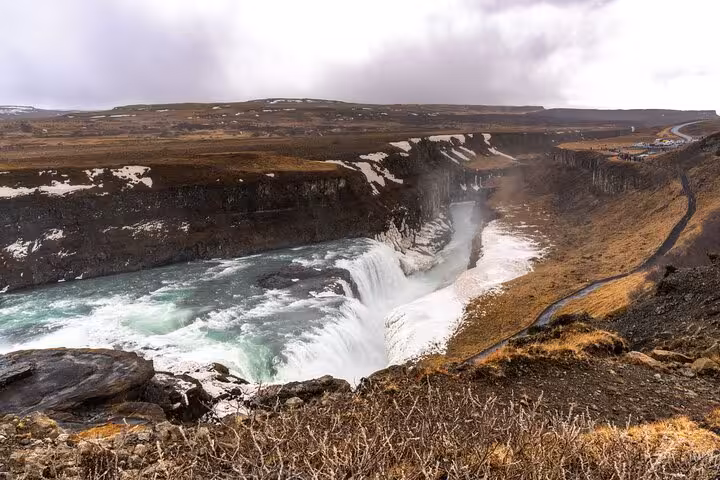 Gullfoss waterfall cascading into a canyon with snow-dusted cliffs on the Golden Circle, Iceland