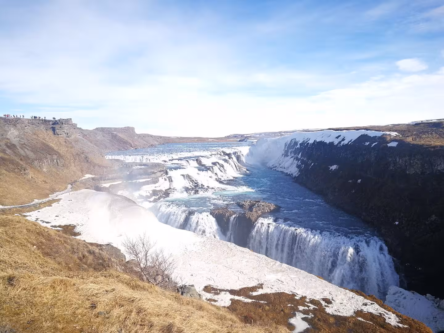 Gullfoss waterfall cascading into a snow-covered canyon in Iceland during winter