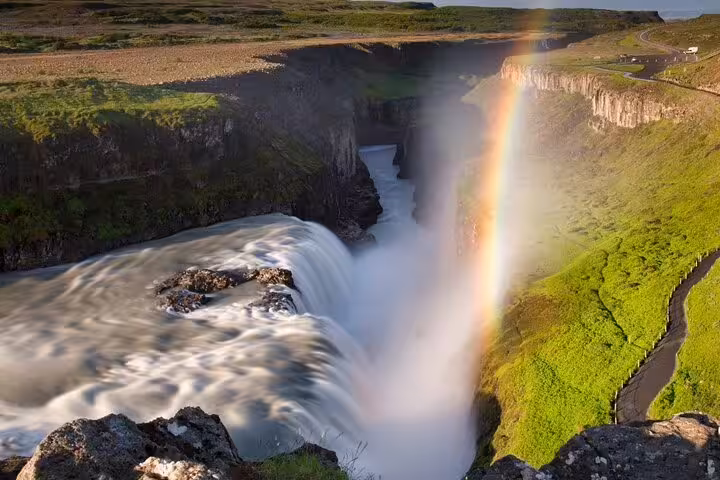 Rainbow over Gullfoss waterfall cascading into canyon on Iceland's Golden Circle route