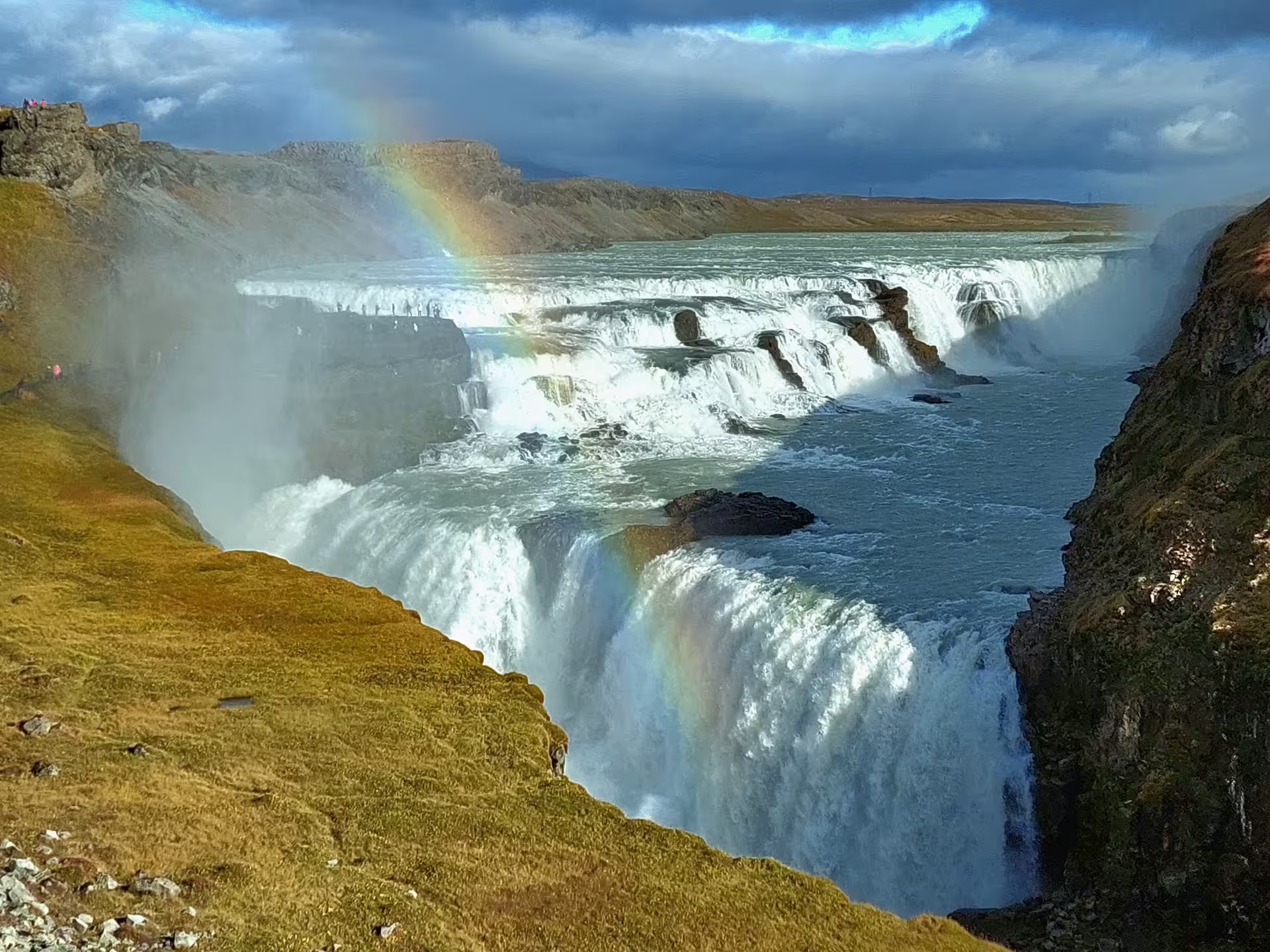 Gullfoss waterfall with double rainbow on Iceland Golden Circle tour