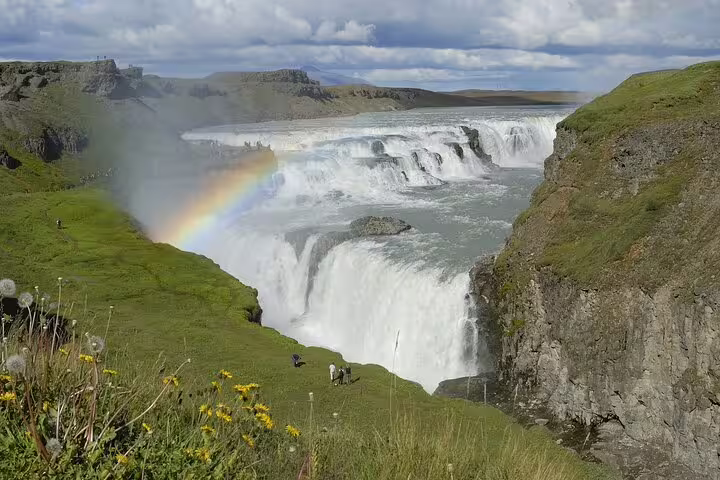 Gullfoss waterfall with rainbow and green canyon walls on Golden Circle tour from Reykjavik