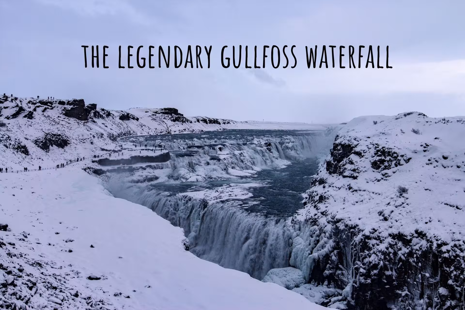 Gullfoss waterfall in winter with snow-covered canyon and cascading water in South Iceland