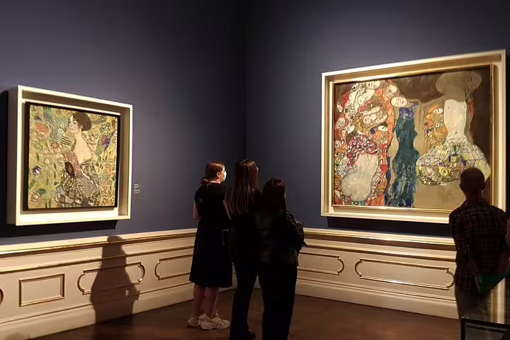 Visitors admire Gustav Klimt paintings at the Belvedere Museum in Vienna during a skip-the-line art tour.
