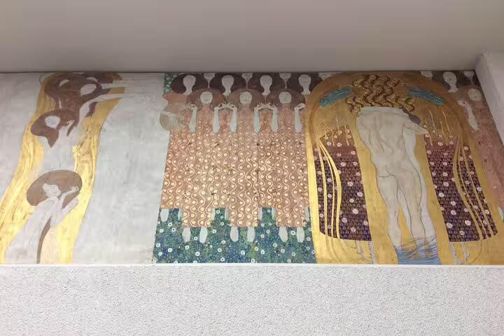 Gustav Klimt's mural at the Secession Building, highlighting intricate designs for Vienna's art tour enthusiasts.