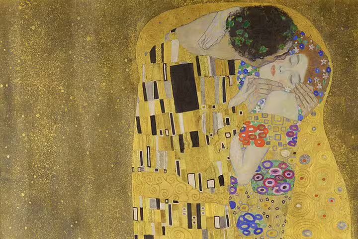 Explore Gustav Klimt's iconic 'The Kiss' with golden hues at Belvedere Palace on the Vienna art tour.