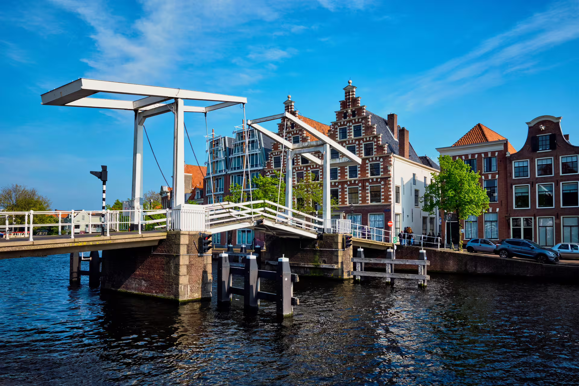 Haarlem canal drawbridge and gabled houses by the water, scenic stop on 1-day audio walking tour