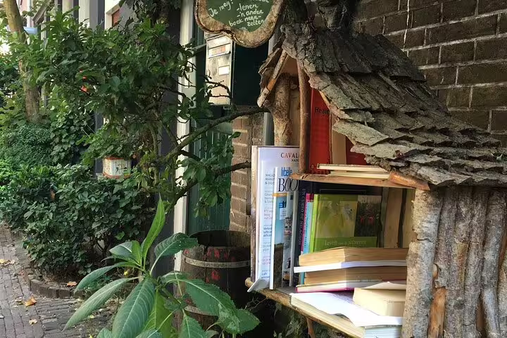 Charming Haarlem old town book nook by a canal house, a hidden stop on a private walking tour