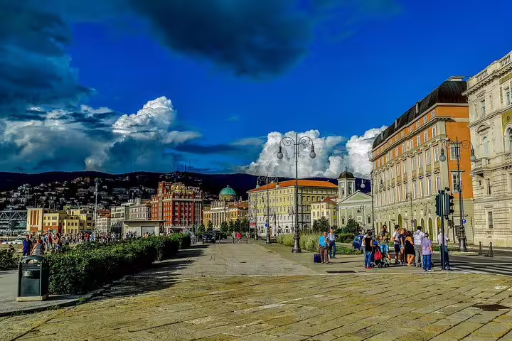 Colorful Habsburg waterfront palaces and lively promenade in Trieste visited on a private guided walking tour