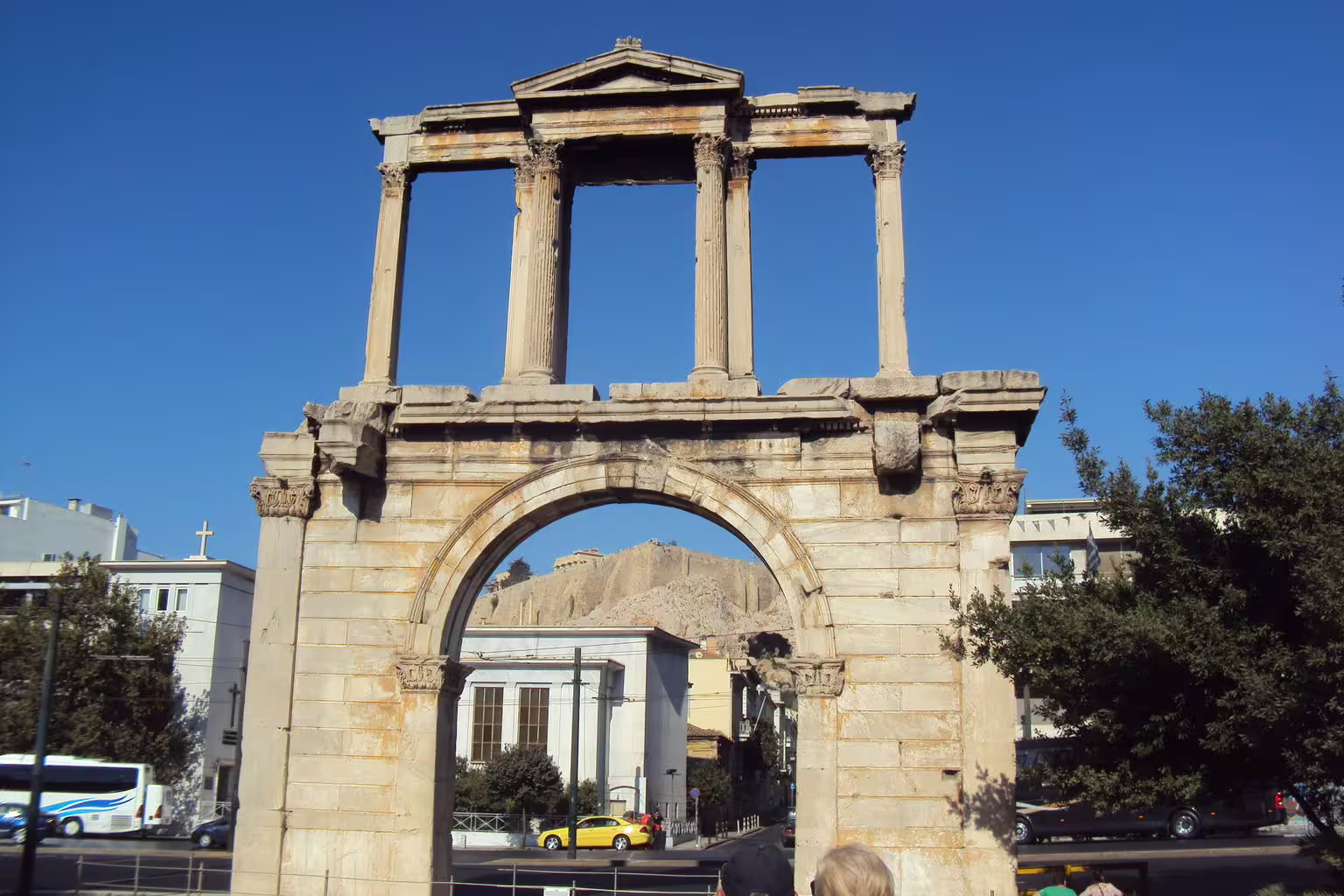 Hadrian’s Arch in Athens with Acropolis hill beyond, key stop on Parthenon, Plaka and Monastiraki walking tour
