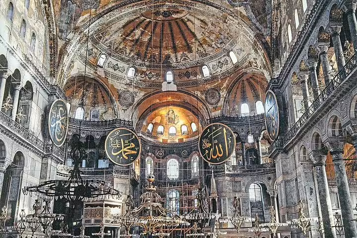 Hagia Sophia interior with grand dome mosaics and calligraphy medallions on Istanbul Old City tour