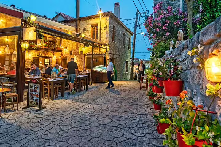 Traditional stone village taverna in Halkidiki at dusk, a stop on a Thessaloniki private day tour with local