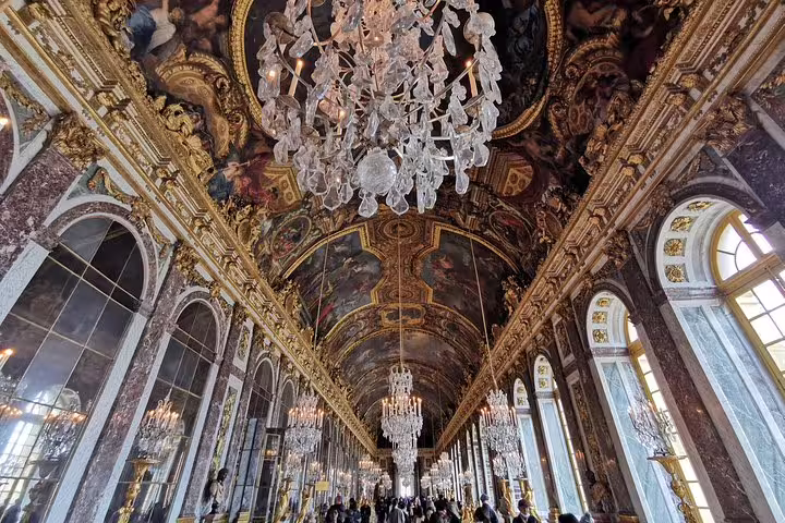 Hall of Mirrors at Versailles Palace with chandeliers on a private guided tour from Paris with hotel pickup