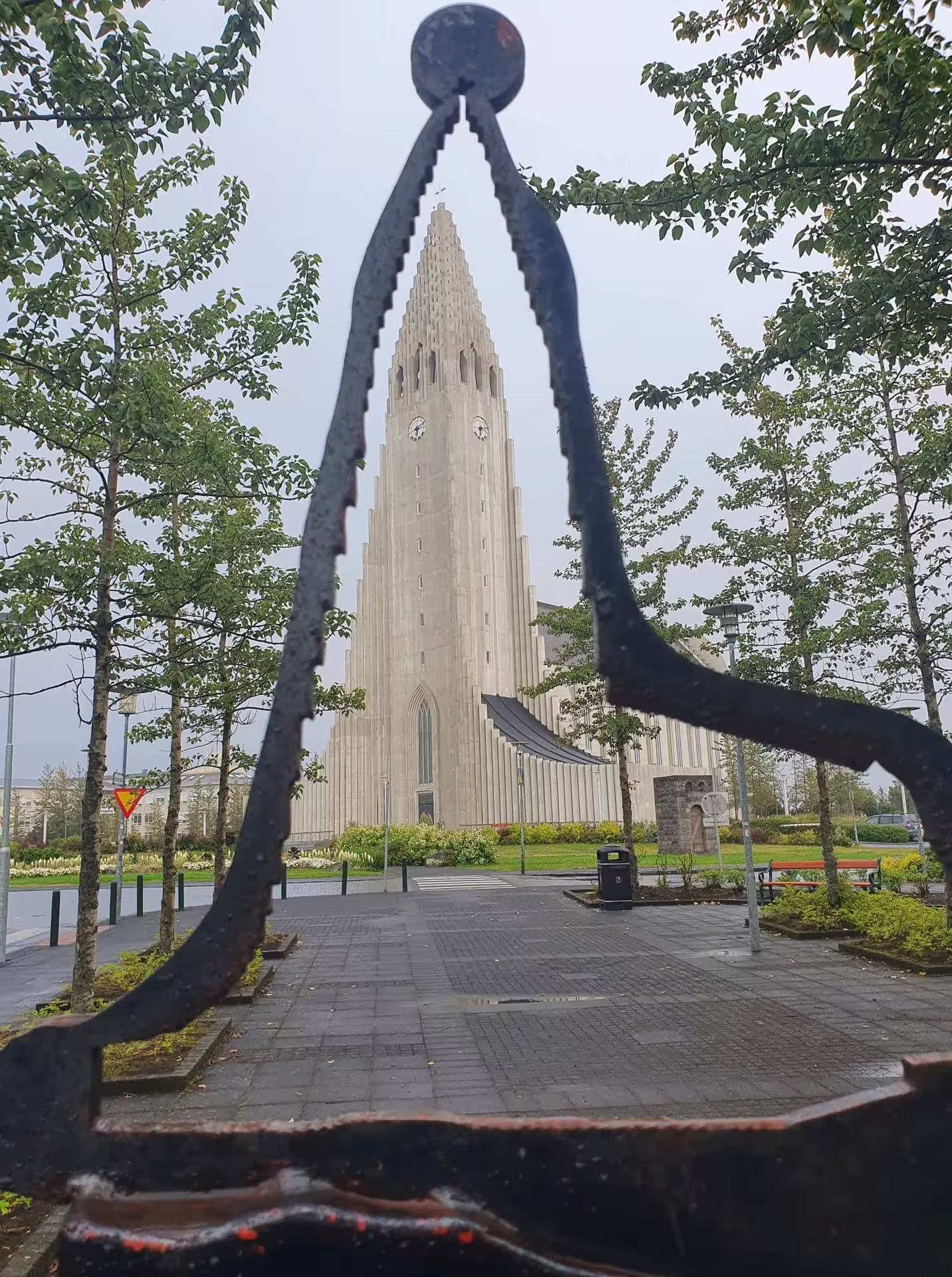 Hallgrímskirkja church tower viewed through a metal sculpture in Reykjavik city center