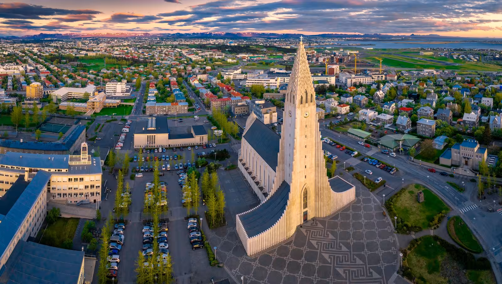 Aerial shot of Hallgrimskirkja church at sunset in Reykjavik, ideal for the Iceland Express Circle self-drive tour.