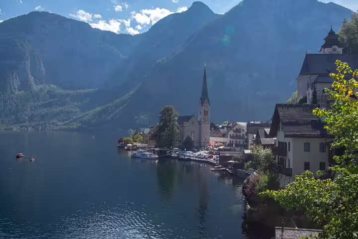 Hallstatt lakeside skyline with church spire and Alps, perfect for a self-guided scavenger hunt highlights tour