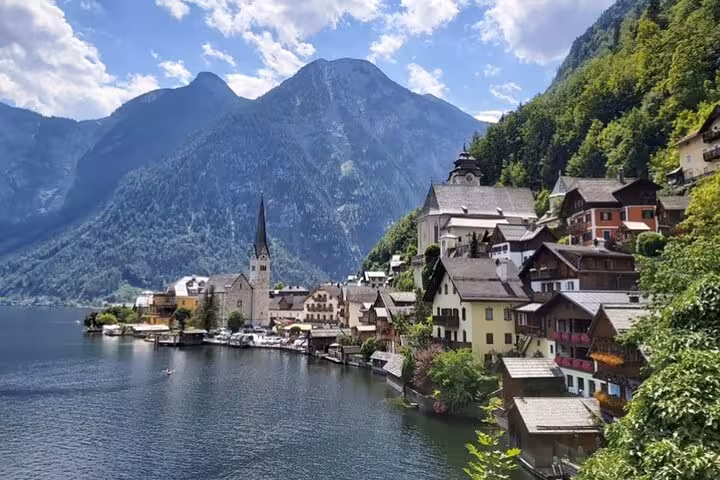 Hallstatt lakeside village and church spire, highlight stop on private Vienna to Salzburg Hallstatt Melk day tour