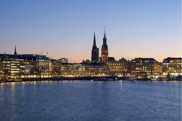 Hamburg skyline at dusk by Alster Lake, ideal for a self-guided scavenger hunt highlights walking tour