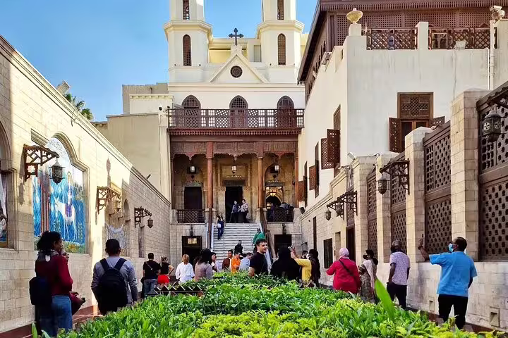 Visitors at Hanging Church entrance in Coptic Cairo, part of Cairo Citadel and Khan El-Khalili tour