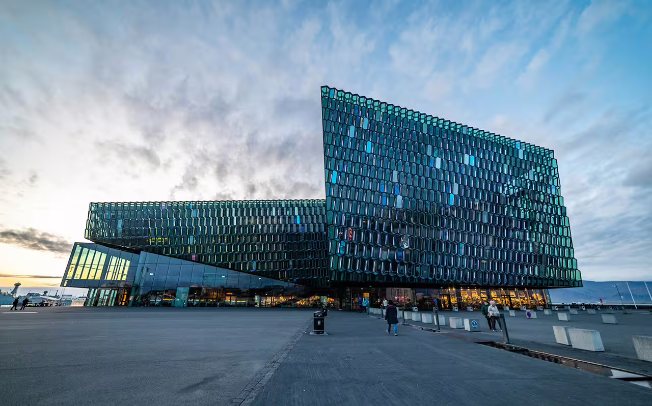 Harpa Concert Hall iconic glass facade on Reykjavik harbor featured in a private 4-hour city sightseeing tour