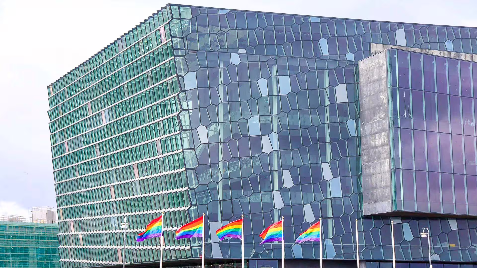 The Harpa Concert Hall during Reykjavik Pride, showing rainbow flags in support of the LGBTQ Community