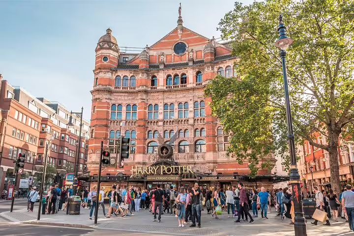Palace Theatre London with Harry Potter and the Cursed Child marquee and crowd of visitors outside