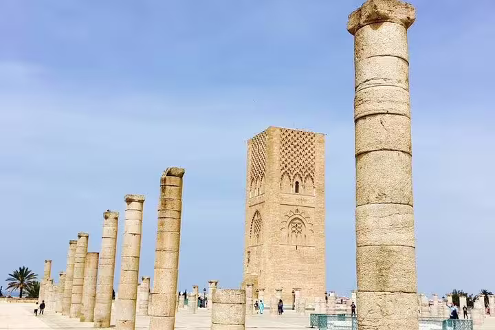 Hassan Tower and ancient columns in Rabat under blue sky, must-see on Morocco 12 days tour from Casablanca
