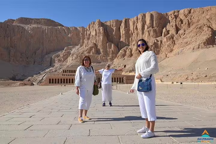 Travelers at Hatshepsut Temple in Luxor, a key stop on 5 days 4 nights Cairo to Luxor package