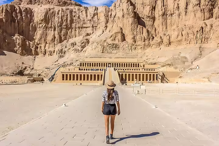 Traveler walking to Hatshepsut Temple in Luxor on Cairo to Luxor by plane small-group tour with guide