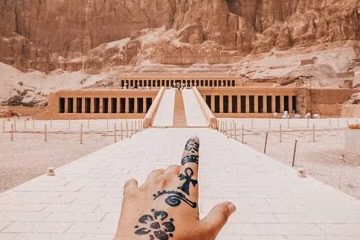 Hand pointing to Hatshepsut Temple, Luxor West Bank on Comfort Luxor trip from Hurghada with King Tut tomb