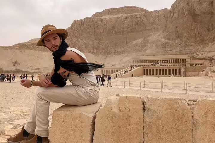 Traveler at Hatshepsut Temple, Luxor West Bank, on 3 nights 2 days Cairo to Luxor sleeper train tour