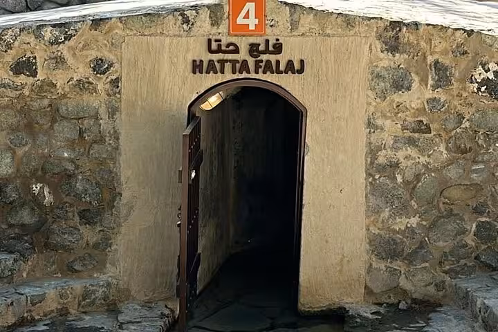 Entrance to Hatta Falaj irrigation tunnel at Heritage Village stop on private full-day Hatta Dam tour for 1–6 pax