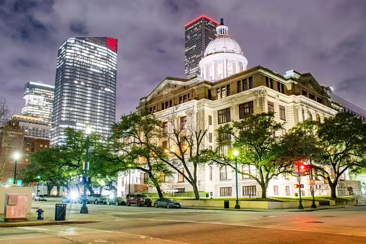 Harris County Courthouse with illuminated dome at night in downtown Houston