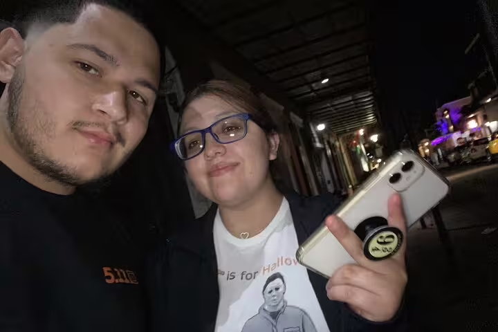 Couple taking selfie at night on New Orleans French Quarter haunted walking tour